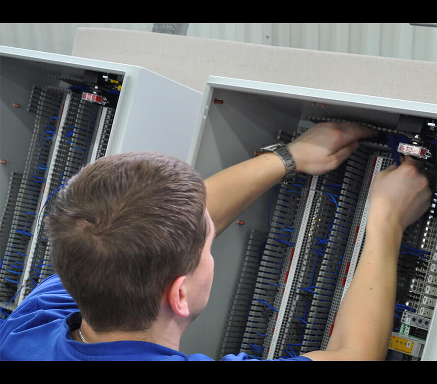 A person fixing an electrical issue.